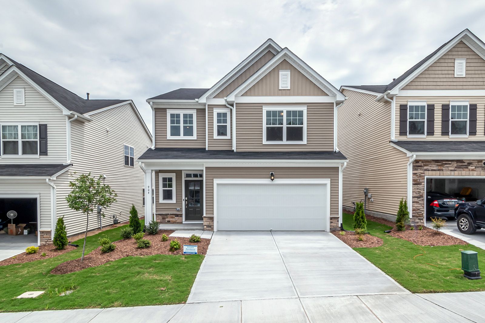 Manicured green lawn in front of a suburban home
